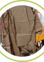 A pile of flattened cardboard boxes for recycling, highlighting sustainability efforts.