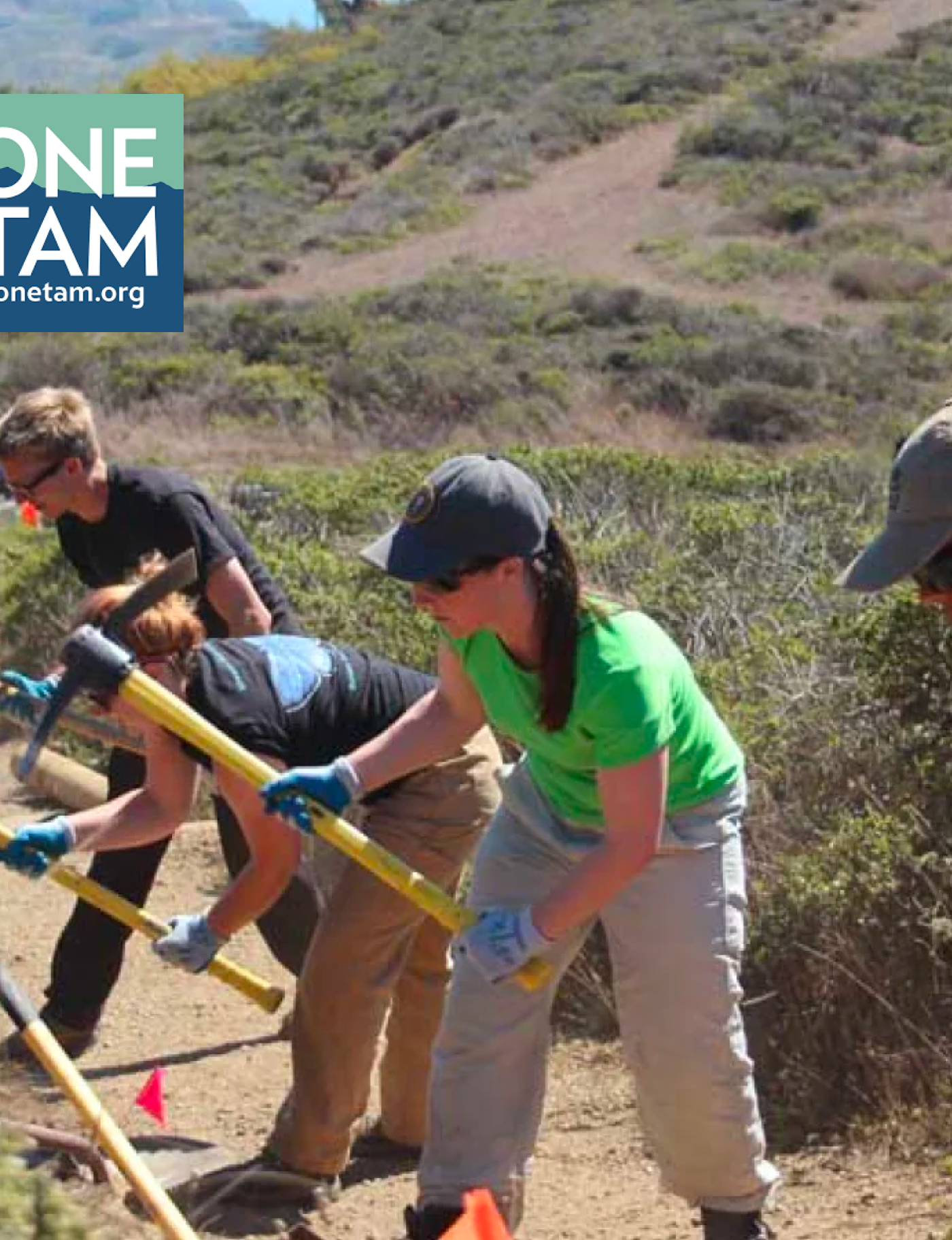 Volunteers maintaining a trail for One Tam, with tools and environmental focus. ONE TAM logo in the corner.