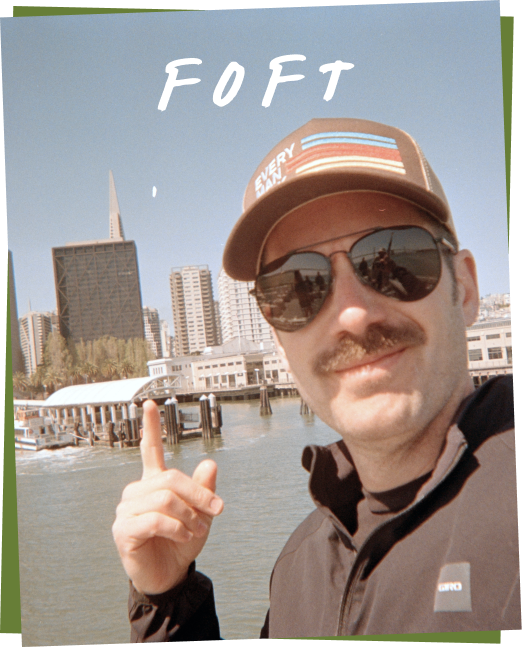 Joe Foft pointing at a building with 'FOFT' and 'EVERY MAN' text.