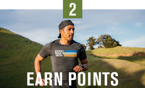 A man running outdoors wearing a shirt with 'EVERY MAN JACK' and colorful stripes, with the text 'EARN POINTS' below.