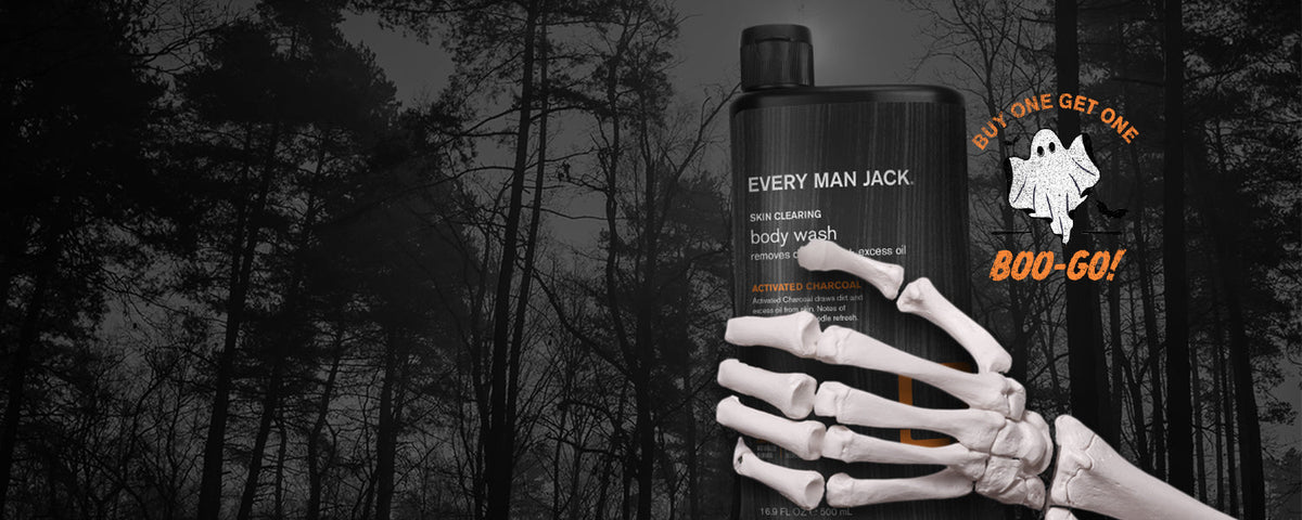 Skeleton hand holding Every Man Jack activated charcoal body wash in a foggy forest with Buy One Get One Boo-Go ghost badge