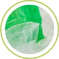 Close-up of green and clear plastic materials, representing sustainable packaging efforts.