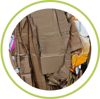 A pile of flattened cardboard boxes for recycling, highlighting sustainability efforts.