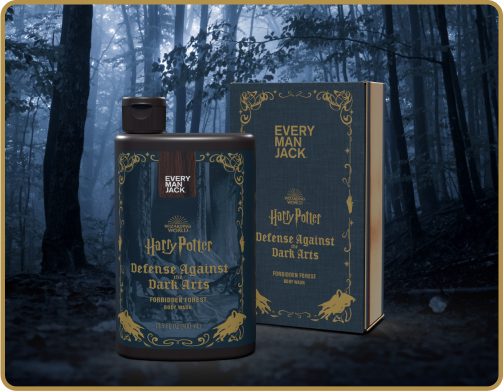 Front view of Harry Potter Defense Against the Dark Arts body wash and box with green and gold packaging in a misty forest