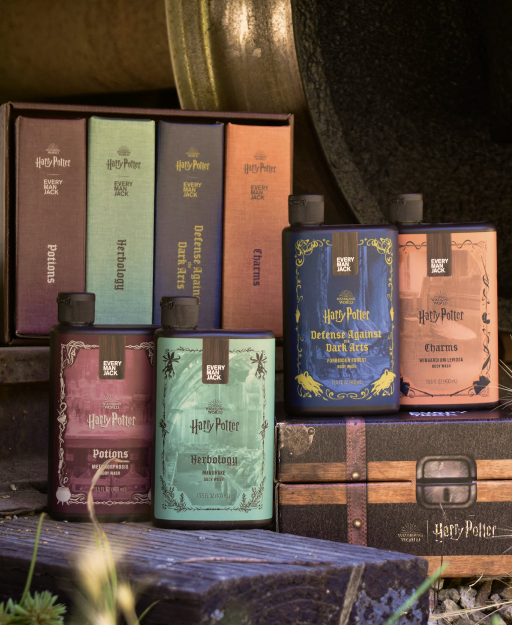Front view of Harry Potter body wash collector set of four showcasing themed labels on a wooden backdrop